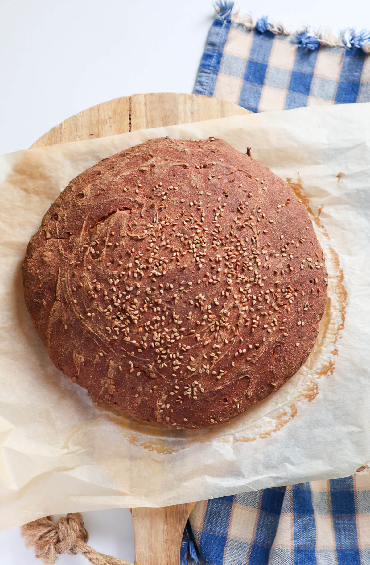 Round artisan looking buckwheat bread on parchment paper