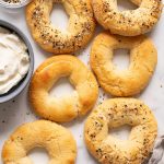 Almond flour Greek yogurt Bagels on a platter with cream cheese and everything bagel seasoning in bowls.